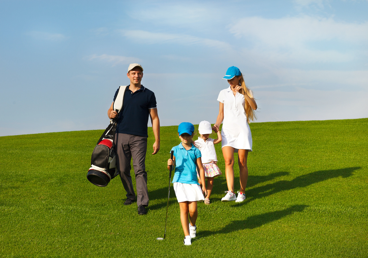 Family of golf players at the course